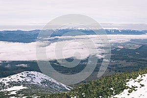 Mountain tops in winter covered in snow - vintage film look