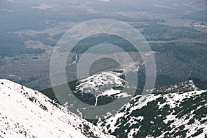 Mountain tops in winter covered in snow - vintage film look