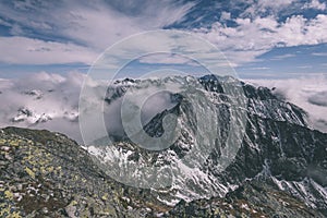 Mountain tops in winter covered in snow - vintage retro look