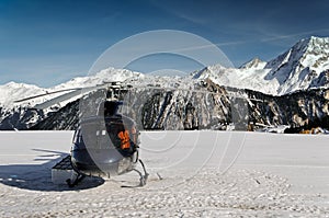 Mountain touristic helicopter in flight