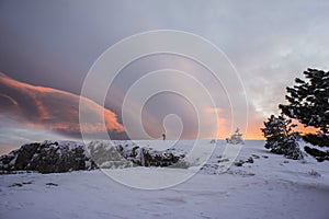 Mountain tourists go to a snowstorm in the mountains.