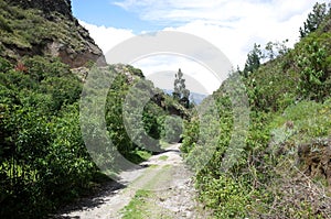 A mountain track winds through the Ecuadorian Andes