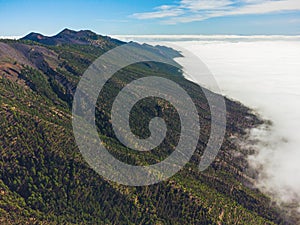 Mountain trail above the clouds on La Palma island. Aerial view