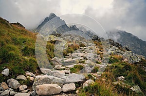 Mountain trail in cloudy scenery