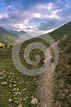 Mountain trail. North Ossetia Alania. The surroundings of the city of Fiagdon. Vertical format.