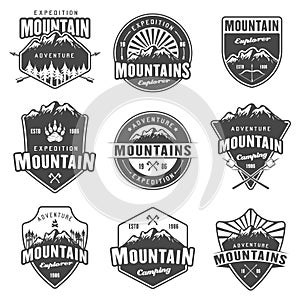 Mountain travel set of black vector retro emblems