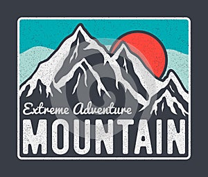 Mountain typography graphics for t-shirt design with mountains, sun and slogan. Vintage tee shirt and apparel print with grunge.