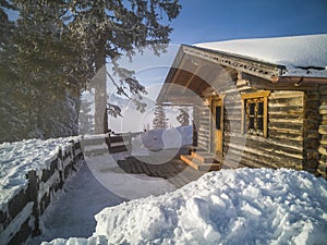 Mountain vacation log houses at ski resort . Winter wonderland.