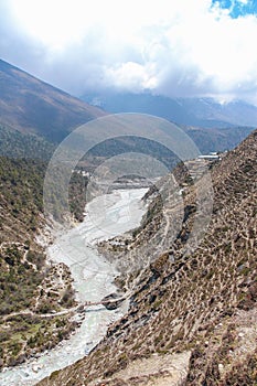 Mountain valley with flowing river in Himalayas photo