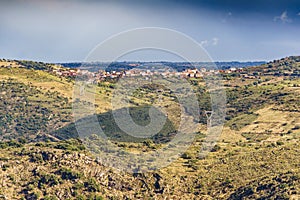 Mountain valley with high voltage towers