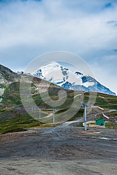 Mountain valley with snow peaks and clouds in Tetnuldi