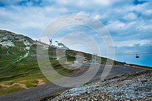 Mountain valley with snow peaks and clouds in Tetnuldi