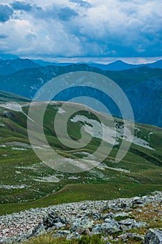 Mountain valley with snow peaks and clouds in Tetnuldi