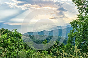 Mountain valley during sunset or sunrise. Natural spring or summer season landscape