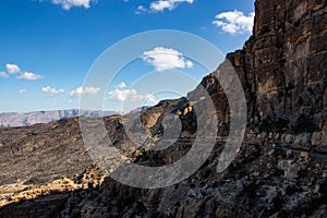 Mountain and valley view along Wadi Sahtan road in Al Hajir mountains between Nizwa and Mascat in Oman photo