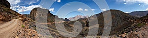 Mountain and valley view along Wadi Sahtan road and snake canyon in Al Hajir mountains between Nizwa and Mascat in Oman