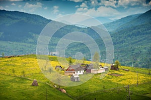 Mountain valley with wooden houses on a hill