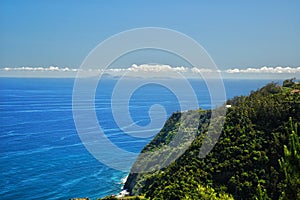 Mountain view across the ocean on tropical island