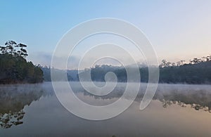 Mountain view  foggy basin floating on the water surface