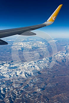 Mountain view from plane wing