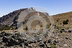 Mountain view, rock, trees and snow