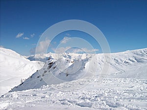 A mountain view with a skiing slope