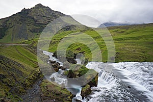 Mountain view of Skogarfoss waterfall, Iceland.