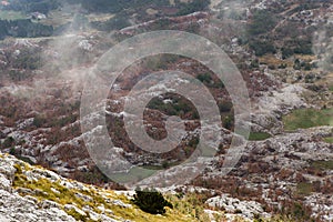 Mountain view with thick clouds down to the lowland