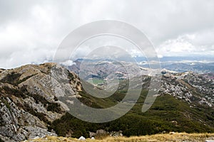 Mountain view with thick clouds down to the lowland