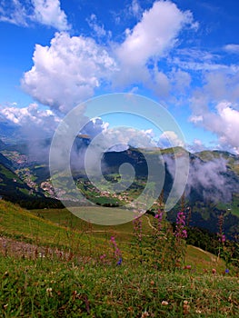 Mountain village and clouds