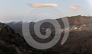 The mountain village of Las Portelas on the island of Tenerife at sunset with exciting clouds.