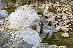 Mountain water stream at the rock in slow motion