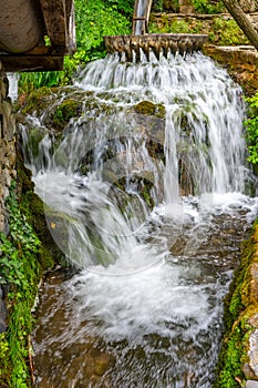 Mountain waterfall in the ethnographic complex `Etera` in Bulgaria