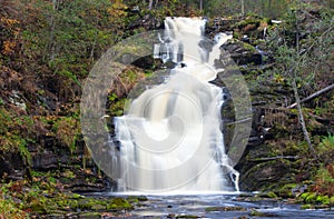 Mountain waterfall. fast stream water