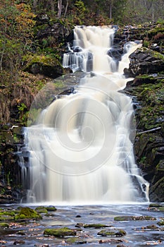 Mountain waterfall. fast stream water
