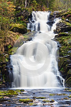 Mountain waterfall. fast stream water