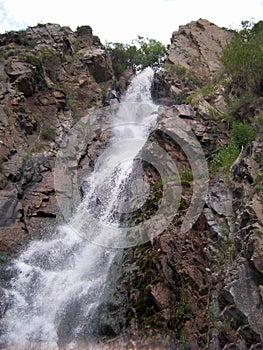 Mountain waterfall, flowing water, from which freshness and coolness proceeds