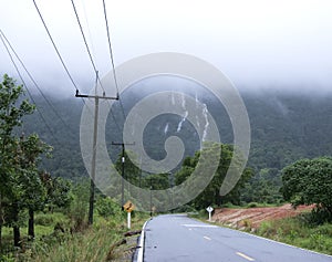 Mountain Waterfall and Foggy