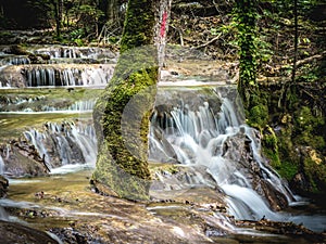 Mountain waterfall on hike path