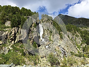 Mountain waterfall among the rocks. Altai mountains, Siberia, Russia