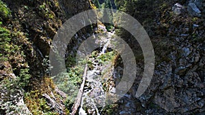 A mountain waterfall in a rocky gorge.