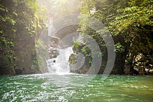 Mountain waterfall in Sunny day.