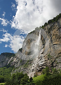 Alpine mountain landscape with waterfall, Lauterbrunnen valley - Switzerland