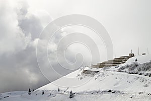 Mountain winter landscape. Mount Grappa war memorial building view