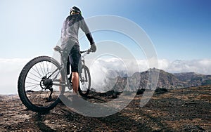 Mountainbiker reaches the peak