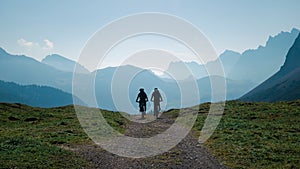 Mountainbiking in the Karwendel mountains in front of blue mountain layers, Austria