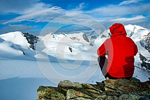 Mountaineer admiring a high mountain landscape