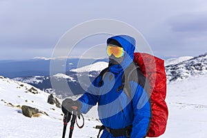 Mountaineer on a background of a winter mountain landscape