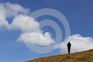 Mountaineer on blue sky