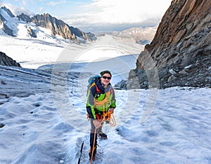 Mountaineer climbing glacier Mont Blanc mountains, France Alps